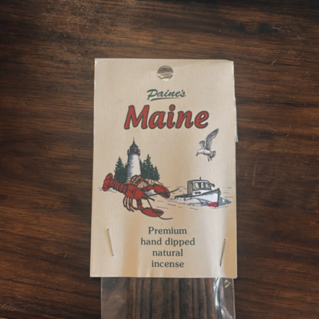 Pack of Maine incense sticks on a wooden surface