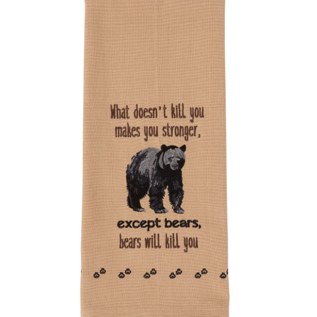 Beige towel with bear embroidery and text on a white background