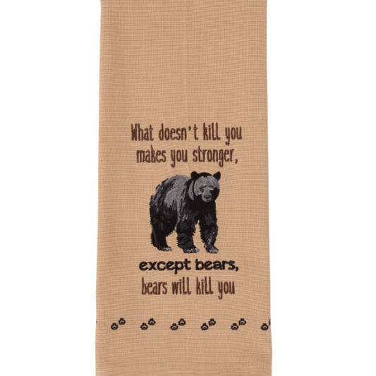 Beige towel with bear embroidery and text on a white background