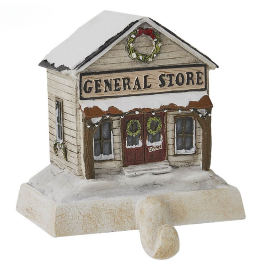 Model of a general store with a snowy roof and wreaths on a white background Christmas Stocking Holder