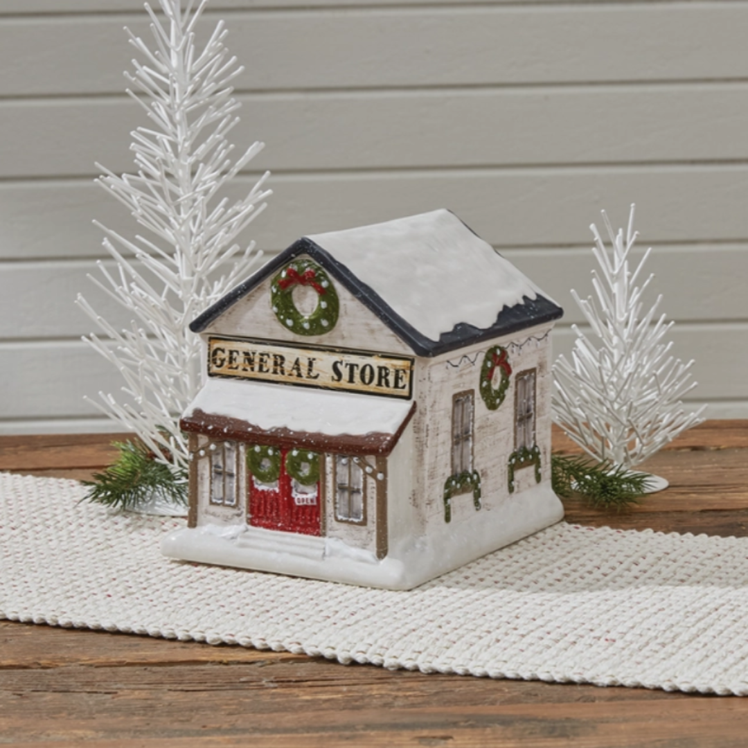 Decorative Cookie Jar of a general store with Christmas wreaths on a wooden table.