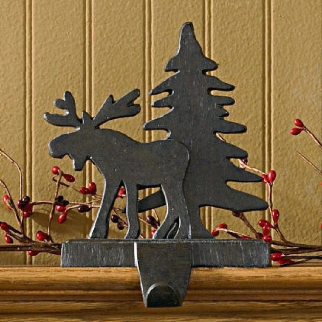 Christmas stocking holders on a mantel.