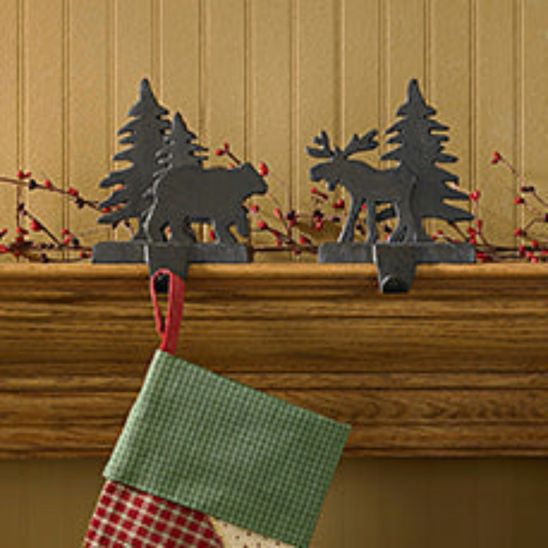 Christmas stocking holders on a mantel.