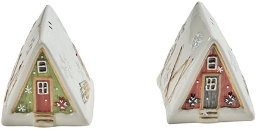 Two triangular ceramic Christmas Cabin salt & Pepper houses with colorful doors on a white background