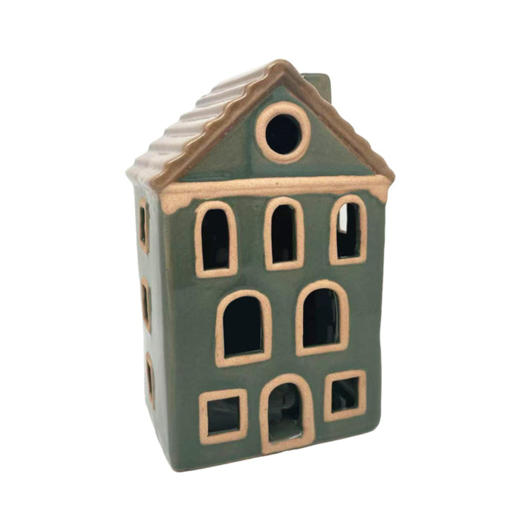 Ceramic house-shaped lantern with green body and brown roof on a white background