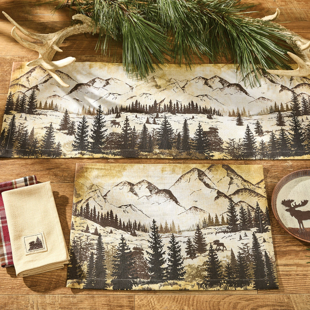 Nature-themed placemats, napkins, and coasters featuring mountain and forest designs.