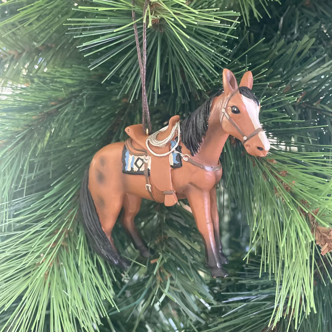 Horse ornament hanging on a Christmas tree