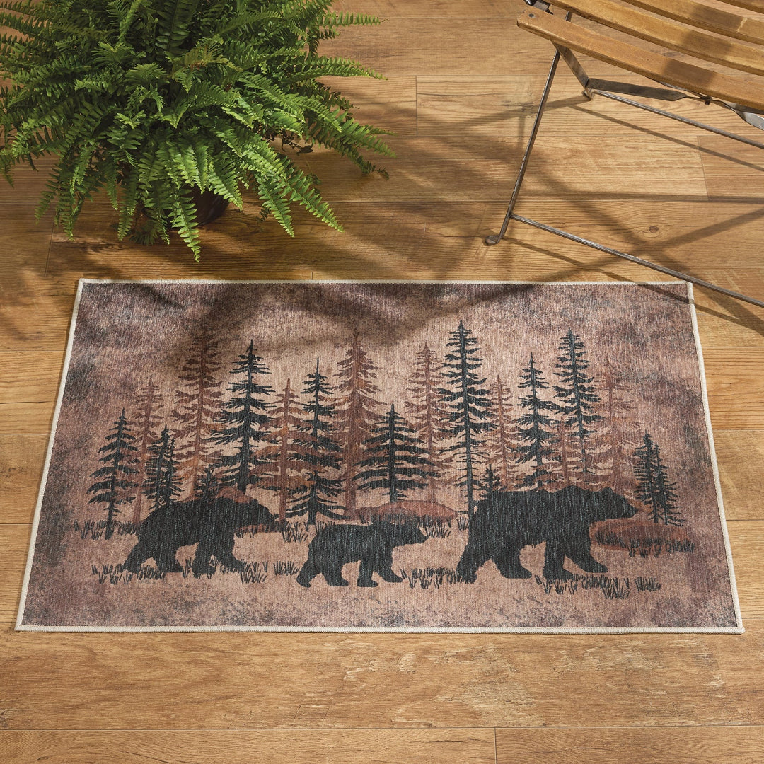 Decorative rug with bear and forest design on a wooden floor