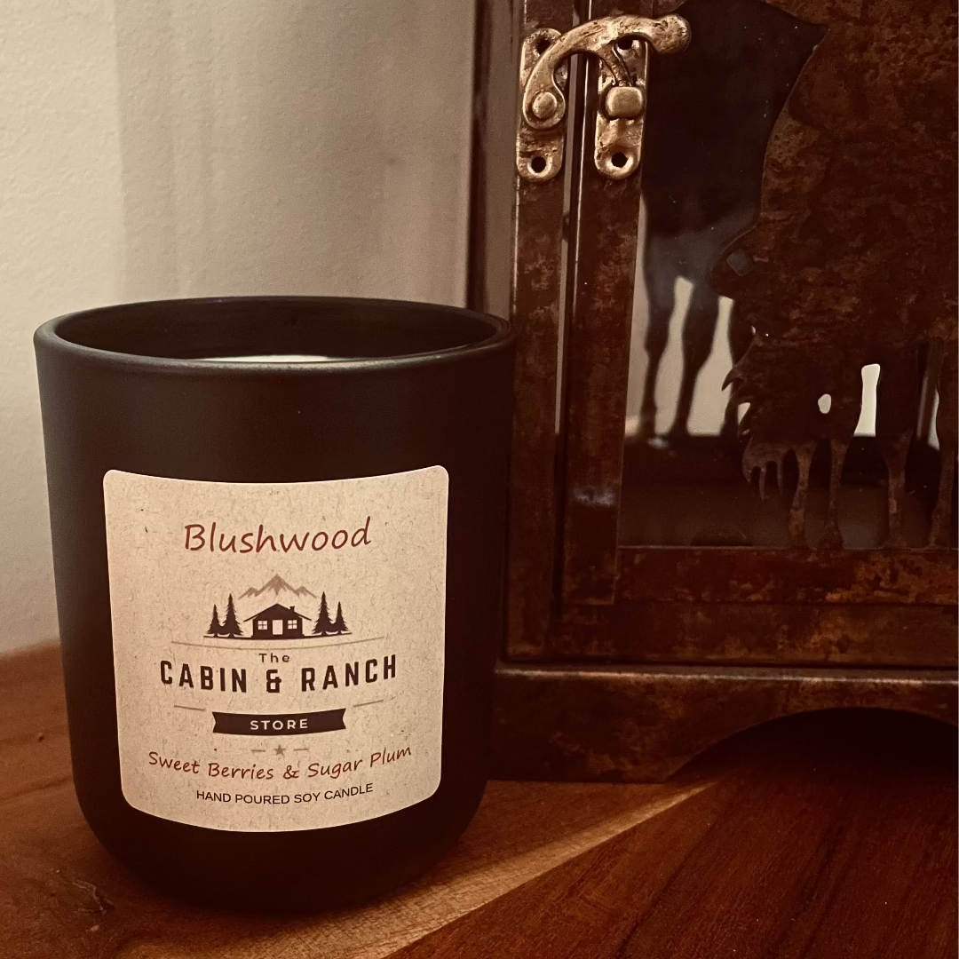 Blushwood Candle, Sweet Berries & Plum, creating a scent that feels both uplifting and comforting. Inspired by quiet mornings in the wilderness from The Cabin & Ranch Store.