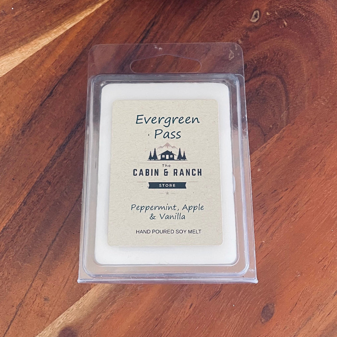 Evergreen Pass Wax Melt combines crisp peppermint, fresh apple and smooth vanilla to create a refreshing and quietly comforting fragrance from The Cabin & Ranch Store.