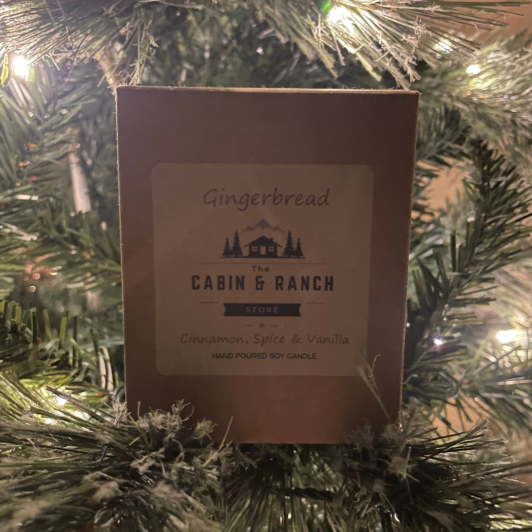 Gingerbread Candle from The Cabin & Ranch Store brand on a Christmas tree.