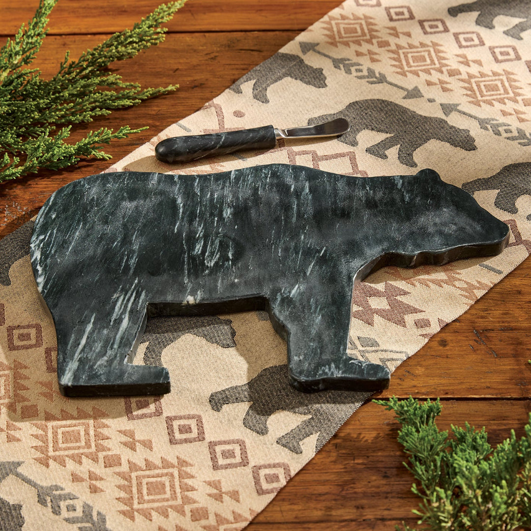 Marble Cutting Board cut out in the shape of a bear with a marble spreader