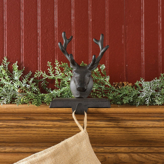 Decorative deer head stocking holder for Christmas stocking.