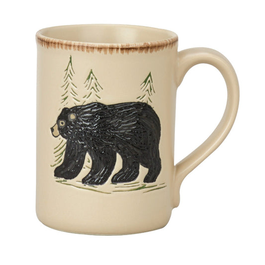 Ceramic mug with black bear and forest design on a white background