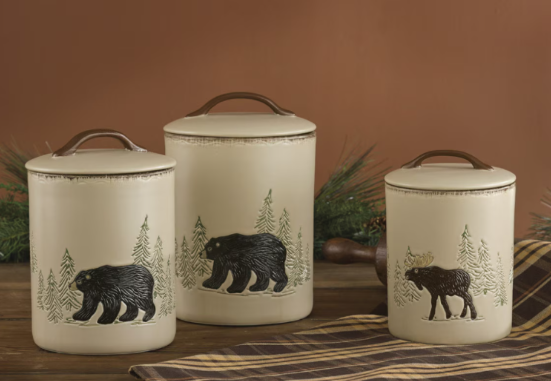 Set of three ceramic canisters with bear and moose designs