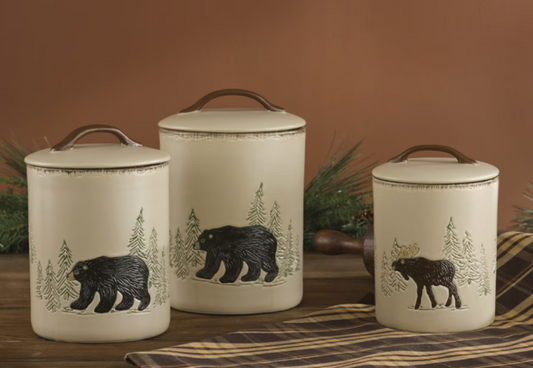 Set of three ceramic canisters with bear and moose designs