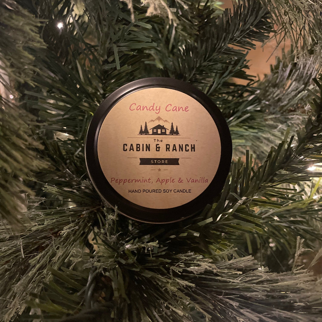 Candy Cane Tin Candle From The Cabin & Ranch Store on a Christmas tree