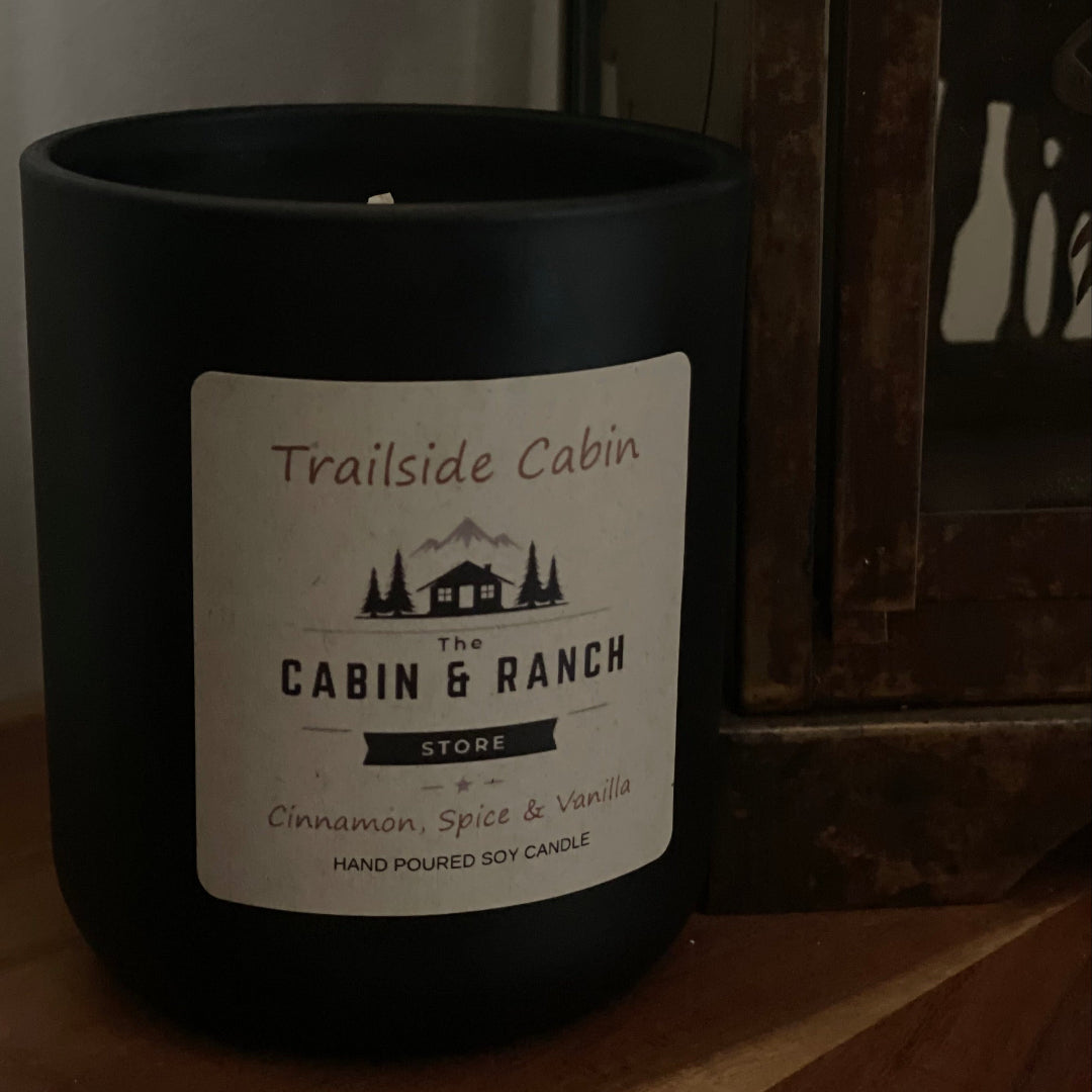 Trailside Cabin Candle with hints of comforting aromas of spiced ginger, creamy vanilla, and freshly baked warmth through the Cabin.