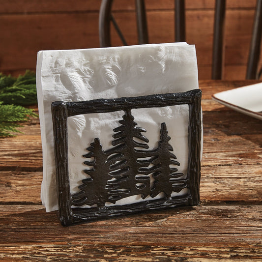Napkin holder with tree design on a wooden table