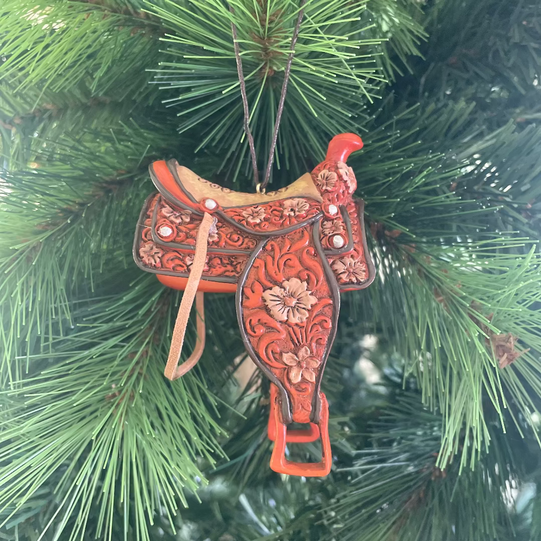 Decorative horse saddle ornament on a Christmas tree